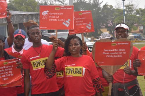 climate activists, farmers, youth and cso leaders walk across the streets toward the capital building to present petition 