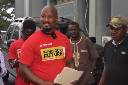 Lawrence Yealue, head of the National Civil Society Council of Liberia presenting the petition 