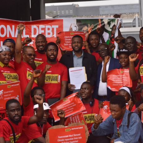 Representative Prince Tole and petitioners of the National Debt and Climate Campaign