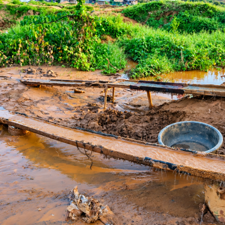 The photo shows a waterlogged and degraded landscape, with muddy water flowing through makeshift channels surrounded by vegetation. It illustrates the difficult environmental conditions faced by climate-vulnerable communities in Liberia, where flooding, erosion and inadequate infrastructure can threaten livelihoods, health and community resilience. The image reinforces the policy brief’s call for fair climate financing, resilient infrastructure and stronger support for women, youth and frontline communities