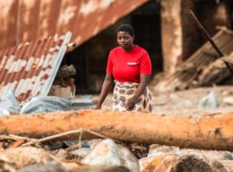 Director of Chigwirizano Women’s Movement and Action Aid partner Loveness Chiwaya is seen moving around Nkhulambe village, inspecting damage in the aftermath of Tropical Cyclone Freddy in Nkhulambe Village